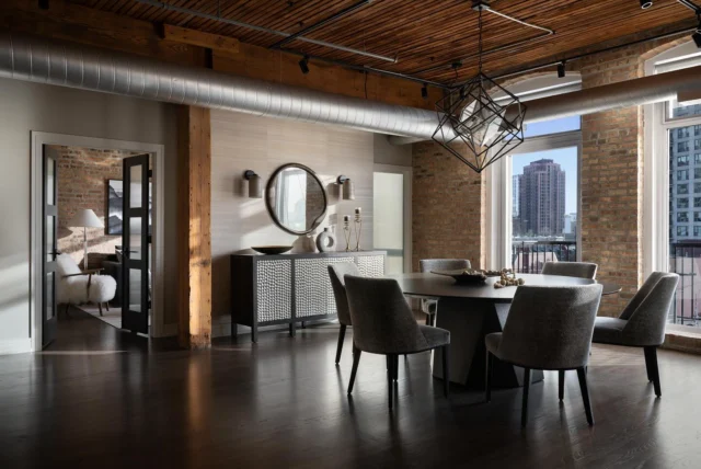 Creating this Dining Room was more than just decorating, with the addition of French doors and a custom reeded glass wall, we built a 3rd Bedroom in this Chicago Loft, creating division of space while still allowing light to flow. A custom 82” round table fills the space and creates a welcoming focal point to grand home.  #StephenYoungDesign